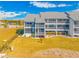 Back view of condo showing balcony and grassy area at 828 Bahia Del Sol Dr # 59/ A, Ruskin, FL 33570