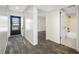 Interior hallway with tile flooring, leading to the living area and bathroom at 828 Bahia Del Sol Dr # 59/ A, Ruskin, FL 33570