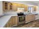 Updated kitchen featuring wood cabinets and tile flooring at 828 Bahia Del Sol Dr # 59/ A, Ruskin, FL 33570