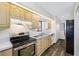Modern kitchen with stainless steel appliances at 828 Bahia Del Sol Dr # 59/ A, Ruskin, FL 33570