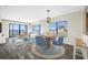 Open living and dining space with ocean view, staged furniture and tile flooring at 828 Bahia Del Sol Dr # 59/ A, Ruskin, FL 33570
