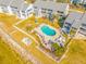Community pool with surrounding patio and lounge chairs at 828 Bahia Del Sol Dr # 59/ A, Ruskin, FL 33570