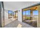 Bright sunroom with tile floors and sliding glass doors leading to a balcony at 828 Bahia Del Sol Dr # 59/ A, Ruskin, FL 33570