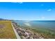 Stunning waterfront view with clear water and a rocky shoreline at 828 Bahia Del Sol Dr # 59/ A, Ruskin, FL 33570