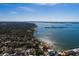 An aerial view of a single-Gathering home situated in a residential neighborhood near the water at 8349 41St N Ave, St Petersburg, FL 33709