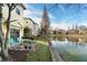 Backyard patio overlooking a lake with seating at 9111 Moonlit Meadows Loop, Riverview, FL 33578