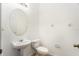 Simple bathroom with pedestal sink and oval mirror at 9111 Moonlit Meadows Loop, Riverview, FL 33578
