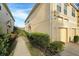 Townhouse exterior showcasing building and landscaping at 9111 Moonlit Meadows Loop, Riverview, FL 33578