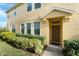 Townhome entrance with landscaping and walkway at 9111 Moonlit Meadows Loop, Riverview, FL 33578
