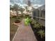 Landscaped backyard with fire pit and patio seating at 103 Rodgers Ne Ave, Port Charlotte, FL 33952