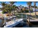 Private boat dock with covered boat lift, perfect for water access at 103 Rodgers Ne Ave, Port Charlotte, FL 33952