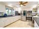 Modern kitchen with stainless steel appliances and white cabinetry at 103 Rodgers Ne Ave, Port Charlotte, FL 33952