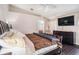 Main bedroom with dark wood furniture and large TV at 10442 Bloomfield Hills Dr, Seffner, FL 33584