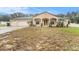 House with three-car garage and a spacious front yard at 10442 Bloomfield Hills Dr, Seffner, FL 33584