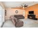 Living room with sectional sofa and built-in fireplace at 10442 Bloomfield Hills Dr, Seffner, FL 33584