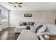 Comfortable living room showcasing a large gray sectional sofa and wood flooring at 12408 Victarra Pl, New Port Richey, FL 34655