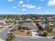 Aerial view of single-Gathering home and surrounding neighborhood at 1311 Caloosa Lake Ct, Sun City Center, FL 33573