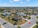 Aerial view of home, highlighting its curb appeal and setting at 1311 Caloosa Lake Ct, Sun City Center, FL 33573