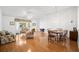 Bright living room with hardwood floors and a dining area at 1311 Caloosa Lake Ct, Sun City Center, FL 33573