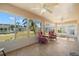 Relaxing sunroom featuring tiled flooring and ample natural light at 1311 Caloosa Lake Ct, Sun City Center, FL 33573