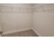 Bright walk-in closet with wire shelving at 13154 Kent Bradley St, Dade City, FL 33525