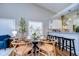 Bright dining area featuring a round table with seating and an open view to the modern kitchen at 13908 Orange Dale Pl, Tampa, FL 33625