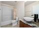 Clean bathroom with modern vanity and bathtub shower combo at 14003 Fareham Rd, Odessa, FL 33556