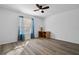 Bright bedroom with laminate flooring, window, and ceiling fan at 14003 Fareham Rd, Odessa, FL 33556