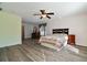 Main bedroom with ceiling fan, wood-look flooring and ample space at 14003 Fareham Rd, Odessa, FL 33556