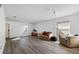 Living room with light hardwood floors and neutral colors at 14003 Fareham Rd, Odessa, FL 33556