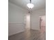 Formal dining room with hardwood floors and wainscoting at 1404 W Granfield Ave, Plant City, FL 33563