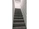 Gray carpeted staircase leading to the upper level at 1404 W Granfield Ave, Plant City, FL 33563