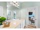 Bathroom featuring a long vanity with view of pool and outdoor kitchen at 15110 Shearcrest Dr, Lithia, FL 33547