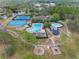 Aerial view of a community pool, playground, and other recreational amenities in a well-maintained neighborhood at 15110 Shearcrest Dr, Lithia, FL 33547