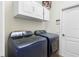 Modern laundry room featuring new washer and dryer appliances at 15110 Shearcrest Dr, Lithia, FL 33547