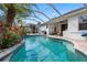 Gorgeous backyard pool with tropical landscaping, a covered lanai and plenty of space for entertaining at 15110 Shearcrest Dr, Lithia, FL 33547