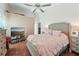 Main bedroom with a king-size bed and plenty of natural light at 1534 Ridge Shore Dr, Tarpon Springs, FL 34689