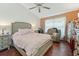 Bright bedroom with a comfortable queen-size bed and hardwood floors at 1534 Ridge Shore Dr, Tarpon Springs, FL 34689