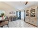 Bright dining area with large windows and a beautiful china cabinet at 1534 Ridge Shore Dr, Tarpon Springs, FL 34689