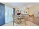 Bright dining area with glass table and chairs, near the kitchen at 1534 Ridge Shore Dr, Tarpon Springs, FL 34689