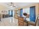 Cozy dining area with glass-top table and stylish china cabinet at 1534 Ridge Shore Dr, Tarpon Springs, FL 34689