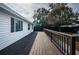 A well-kept, spacious deck with a brown railing, ideal for relaxing and enjoying the outdoors at 1570 S Michigan Ave, Clearwater, FL 33756