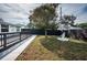 Backyard view of home showcasing a decorative fountain and newly stained wooden deck at 1570 S Michigan Ave, Clearwater, FL 33756