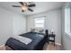 Bedroom features neutral walls, vinyl flooring, and a bright window with white blinds at 1570 S Michigan Ave, Clearwater, FL 33756