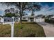 A quaint home exterior featuring an American flag, nice lawn, and a welcoming mailbox at 1570 S Michigan Ave, Clearwater, FL 33756