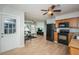 Open floor plan includes kitchen with black appliances and wood cabinetry at 1570 S Michigan Ave, Clearwater, FL 33756