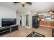 Open-concept living room with a ceiling fan and easy access to the kitchen at 1570 S Michigan Ave, Clearwater, FL 33756