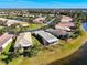 Aerial view of community, showcasing lakefront property at 15856 Cobble Mill Dr, Wimauma, FL 33598