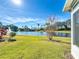 Backyard with partial view of lake and fountain at 15856 Cobble Mill Dr, Wimauma, FL 33598