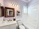 Bathroom with white tile and a bathtub at 15856 Cobble Mill Dr, Wimauma, FL 33598